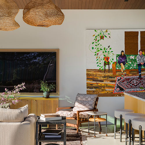 Open-concept living room at the Eucalyptus Hill ADU Residence in Montecito featuring custom furnishings, woven pendant lights, and indoor-outdoor living.