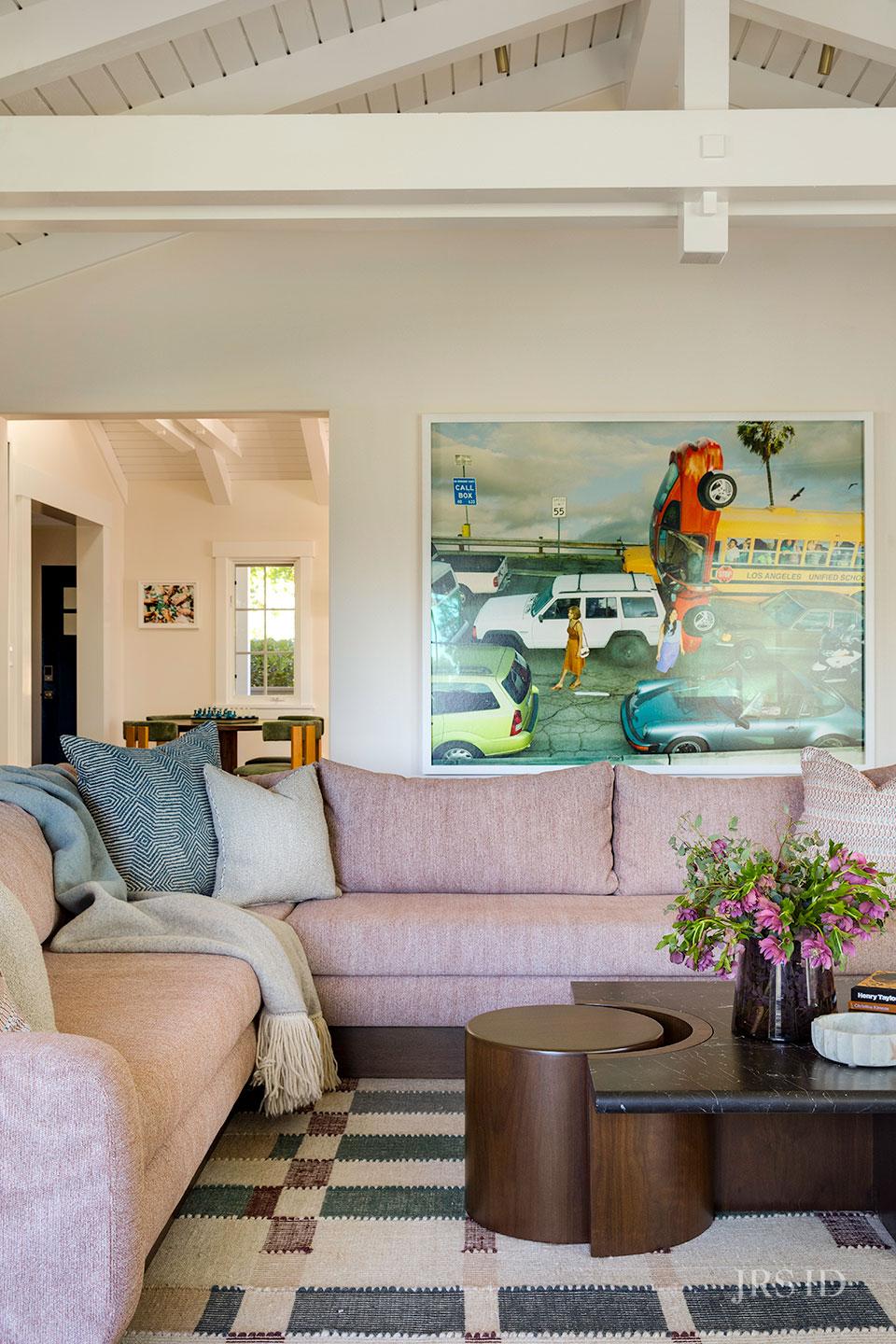 Custom pink sectional sofa in Montecito living room with layered textiles, contemporary artwork, and Santa Barbara interior design